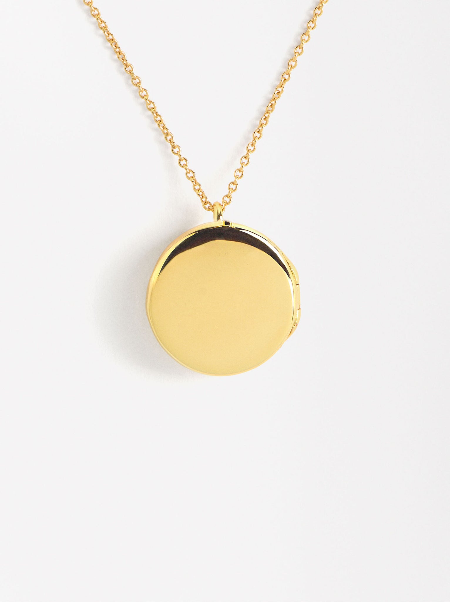 Collar medalla relicario con circonitas baño oro 18k